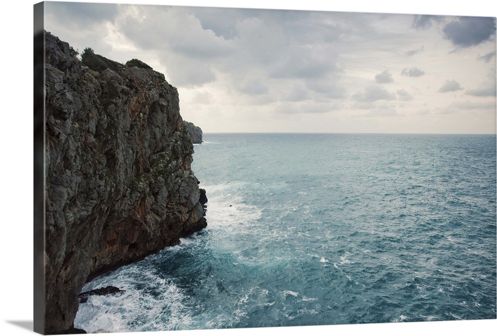 Cliff line and blue wild stormy Mediterranean sea, Mallorca.