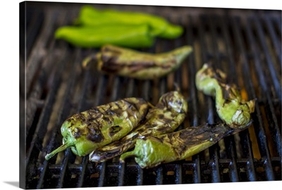 Close up of charred chilies on grill