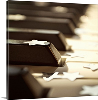 Close up of piano keys with stars.