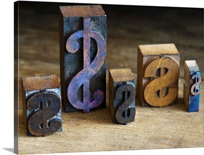 Close up of printing blocks with dollar sign on wood