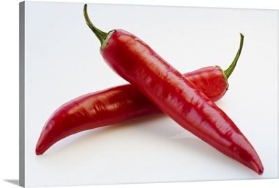 Close up of red chili peppers on white background