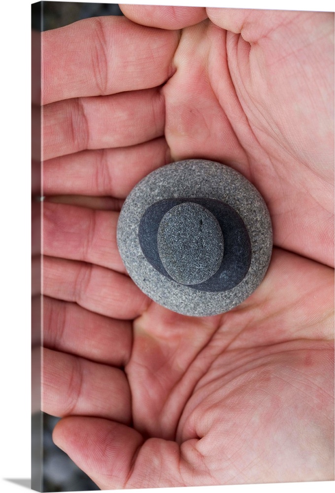 Close up of stacked rocks in hand