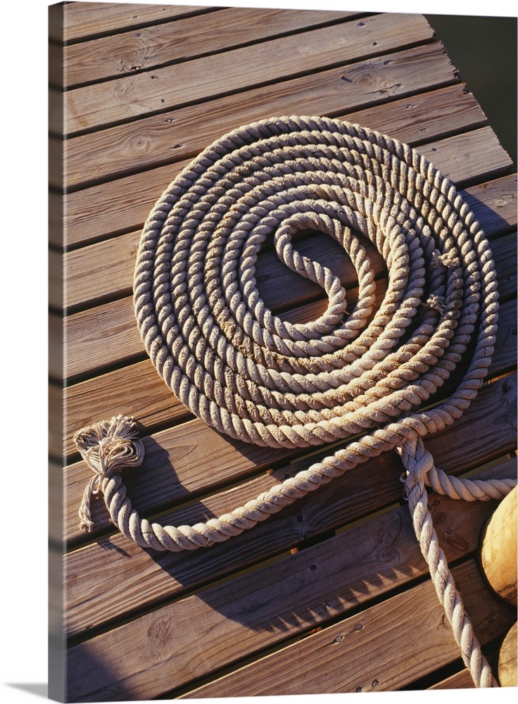 Coil of rope lying on wooden pier, elevated view Wall Art, Canvas Prints, Framed Prints, Wall
