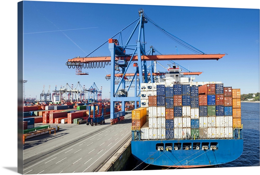 Container ship being loaded/unloaded in container terminal