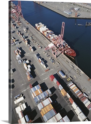 Container ship alongside commercial dock, aerial view