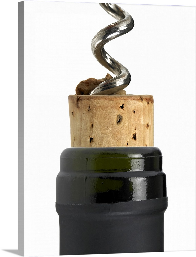 Corkscrew and cork, photographed on white surface. Part of the bottle's neck can be seen too. The frame of the photograph ...