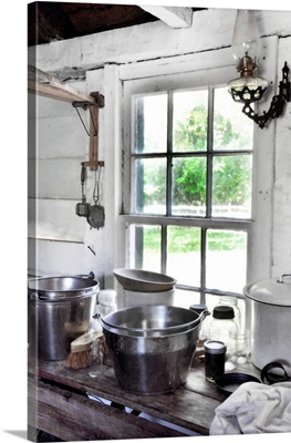 Cottage kitchen window and stainless pots and pans