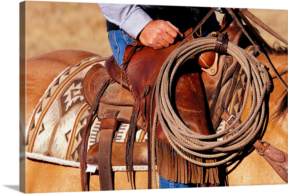 https://static.greatbigcanvas.com/images/singlecanvas_thick_none/getty-images/cowboy-saddling-up,2241087.jpg