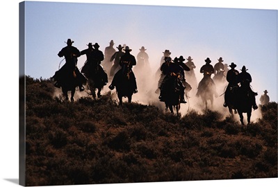 Cowboys riding horses, silhouette