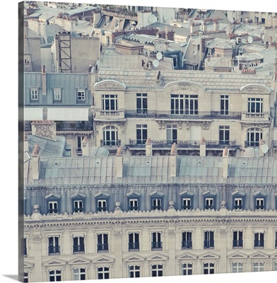 Cream colored apartments with grey blue roofs in Paris, France.