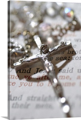 Crucifix on rosary with bible