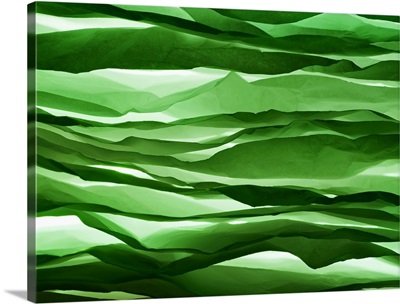 Crumpled sheets of green paper.