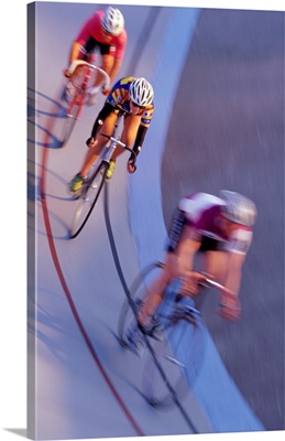 Cyclists racing in velodrome (blurred motion)