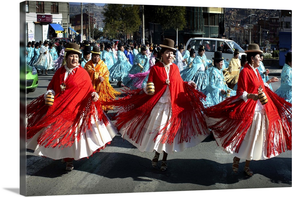 Dressed in the traditional indigenous Aymaran clothing of bowler hats, mantas or shawls and pollera dresses, cholitas danc...