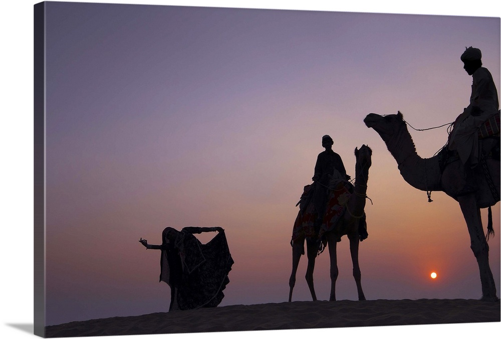 Silhouette of Folks Dancer and camel herders at Thar desert.