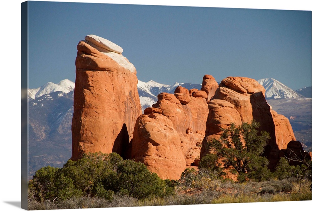 Rock formations in the Devil's Garden area with the snow capped La Sal Mountains in the background Arches National Park, Utah