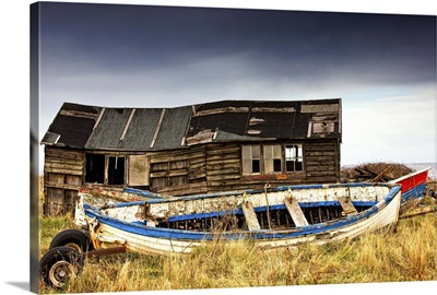 Dilapidated boathouse and boat, Beadnell, Northumberland, England