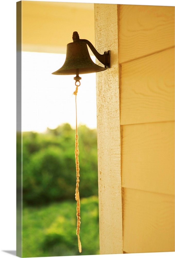 Dinner bell on side of house