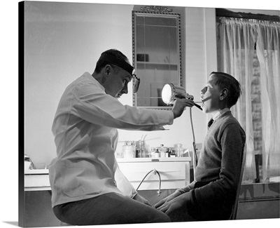 Doctor Examining Boy Patient