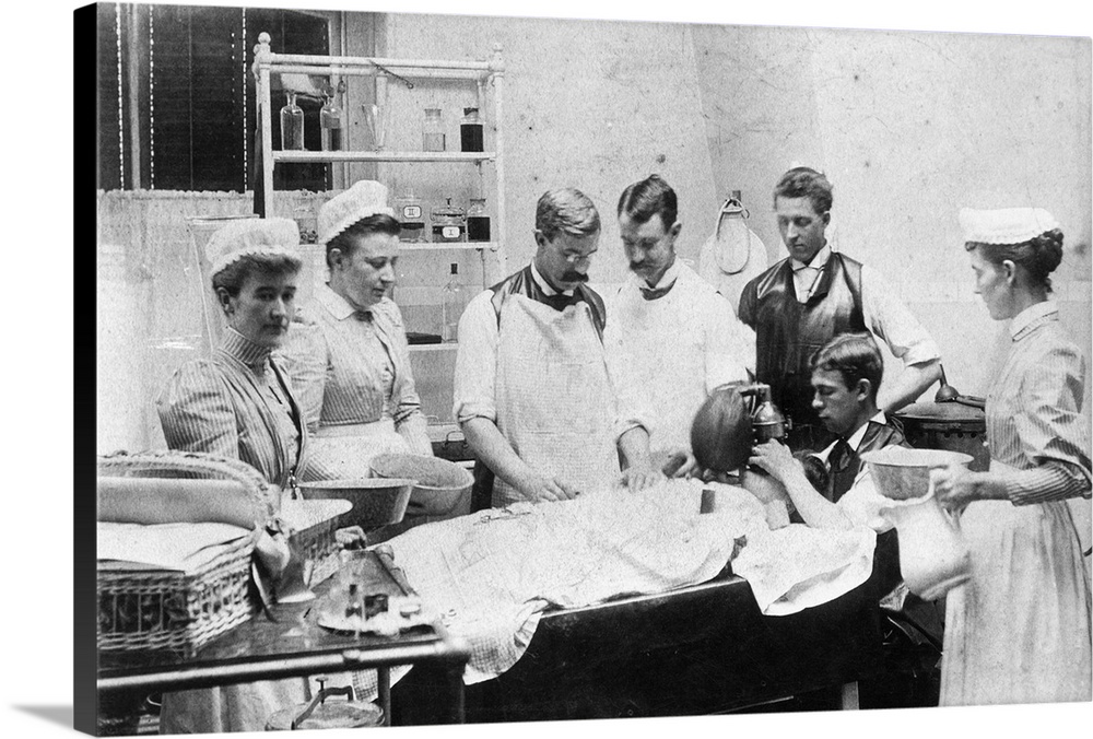 A surgical team at Bellevue Hospital in New York, administer anesthesia to a patient in preparation for surgery.