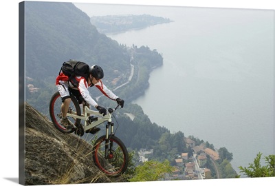 Downhill cyclist on an abyss