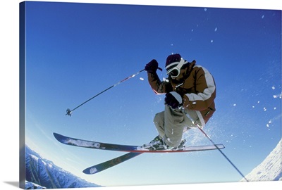 Downhill skier in mid-air