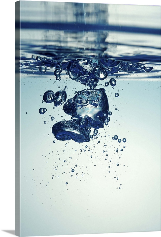 Droplet forming bubbles, underwater view, studio shot