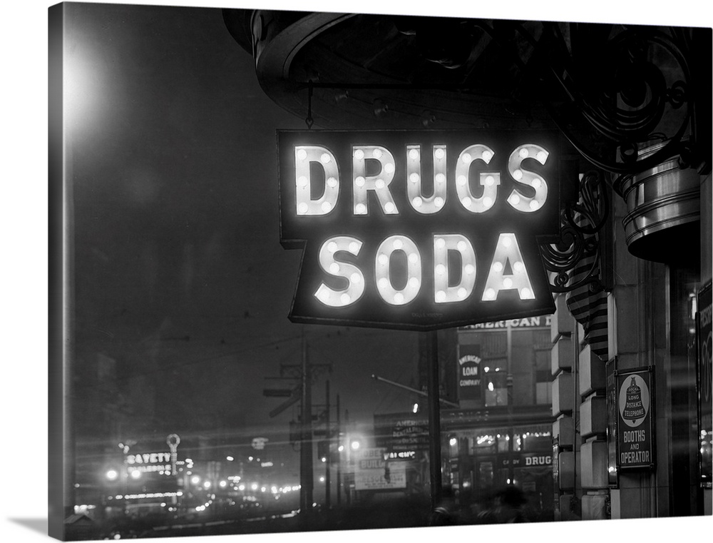 The sign above the Firemen's Drug Store that indicates Drugs and Soda is illuminated by 110-5 watt Mazda sign lamps.