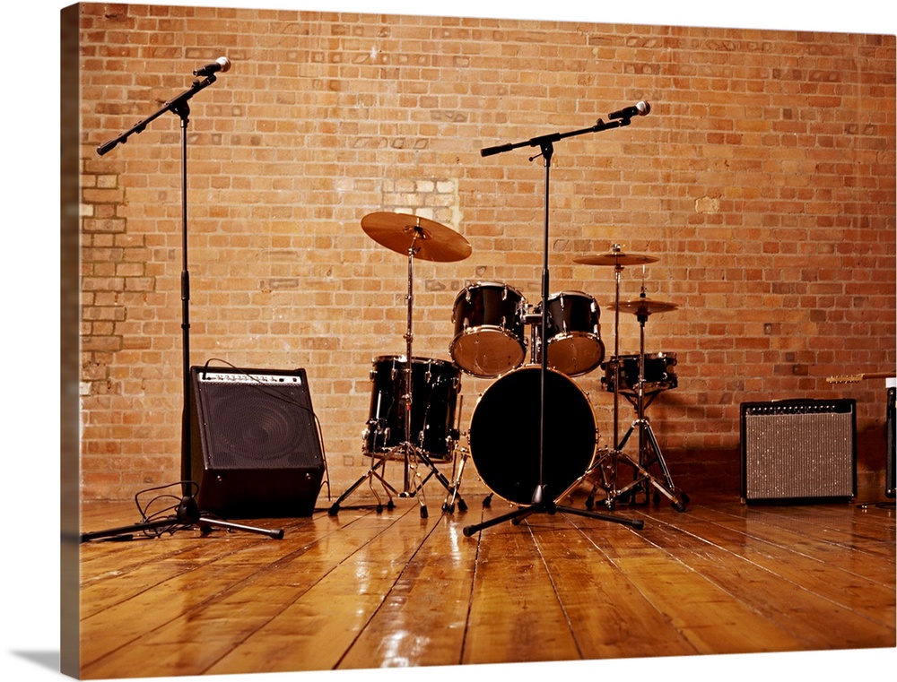 Photograph of musical instruments including a snare drum, bass, high hat cymbal, and crash cymbal with amp and audio equip...