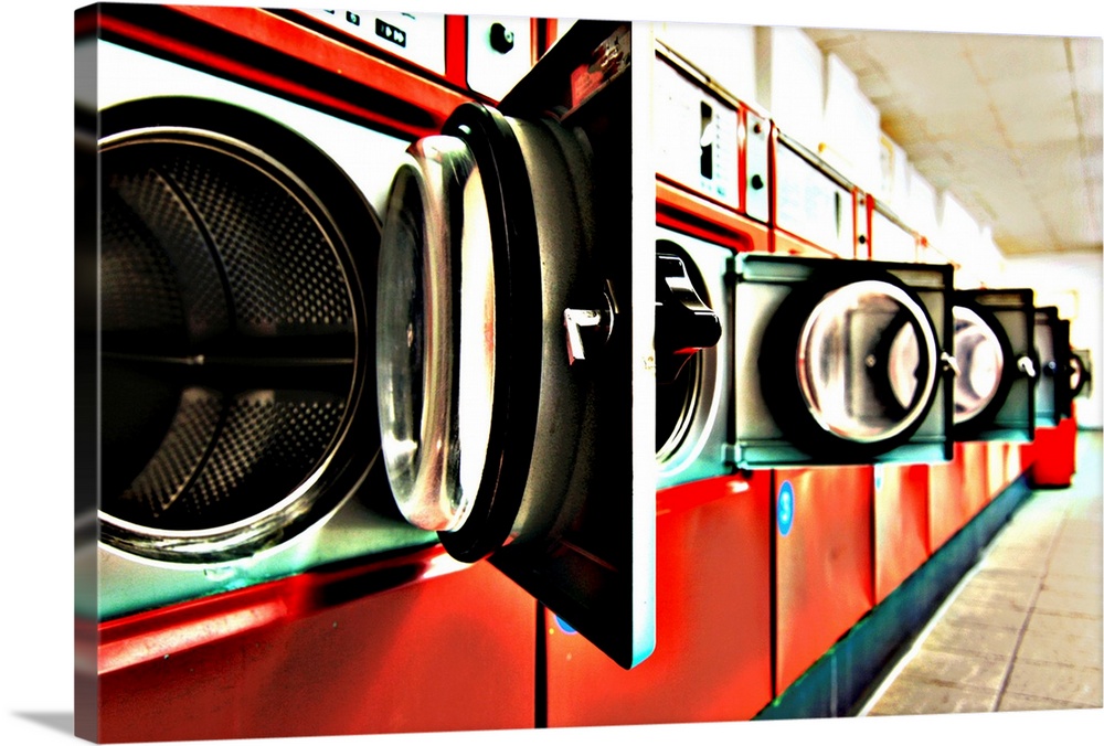 open doors of washing machine at Launderette.