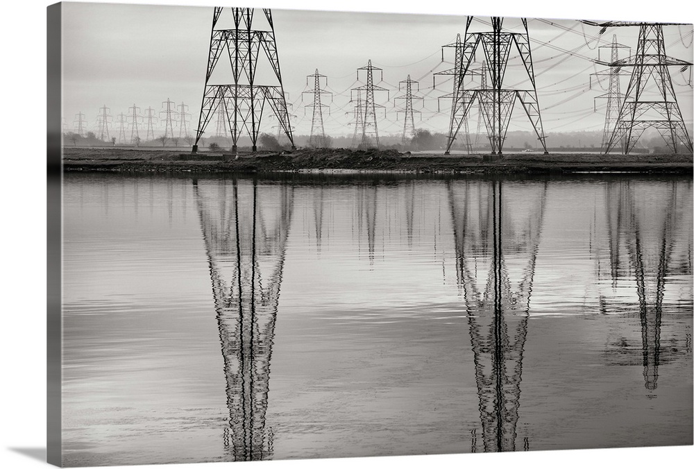 Electricity Pylons reflected in Forth Estuary, Scotland.
