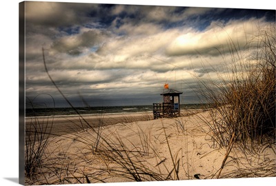 Empty moody beach with lifeguard hut