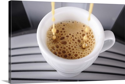 Espresso pouring into a cup