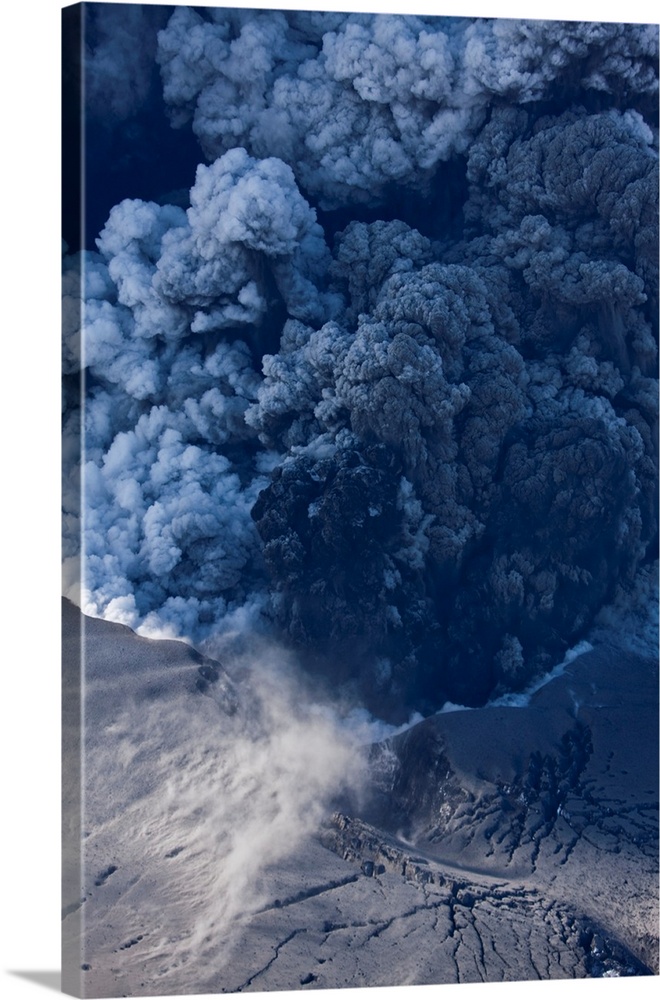 Massive ash plume erupting through 200 meter thick glacial ice sheet at the summit of Eyjafjallajokull volcano.