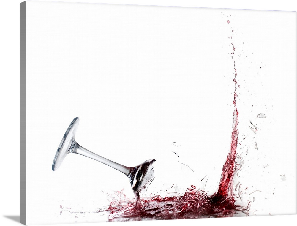 Giant photograph displays a piece of stemware filled with vino as it crashes into the ground and the liquid splashes out.
