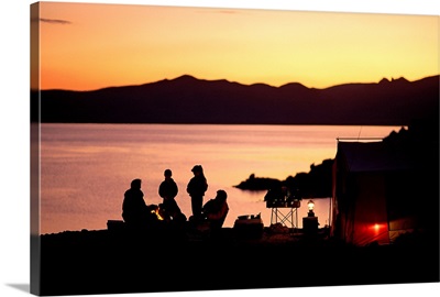 Family camping at sunset