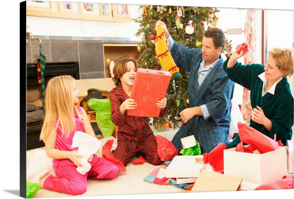 Family opening gifts at Christmas
