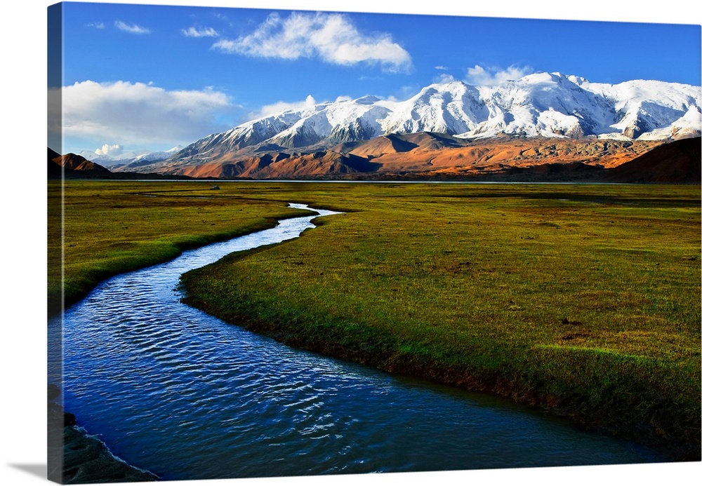 'Mu Shi Ta Ge' Snow mountaion,called in Chinese, and grassland river at sunset time. Xinjiang province, North-west of China.