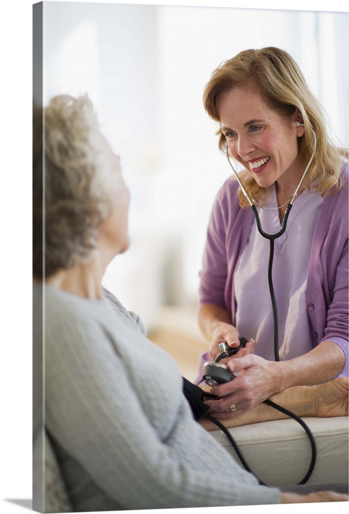 USA, New Jersey, Jersey City, Female nurse checking patients blood pressure