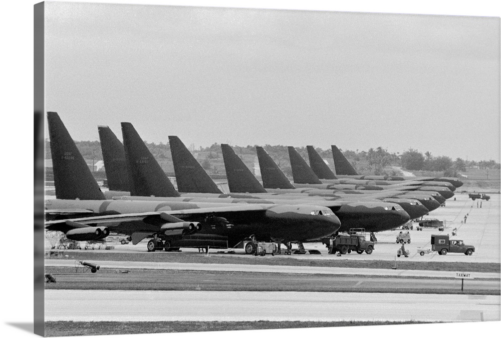 Bombs in place, the giant B-52s are lined up ready for the voyage to Vietnam and a bombing mission. It was announced recen...