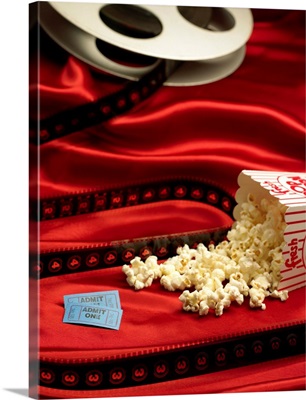 Film reel, popcorn, and admission tickets