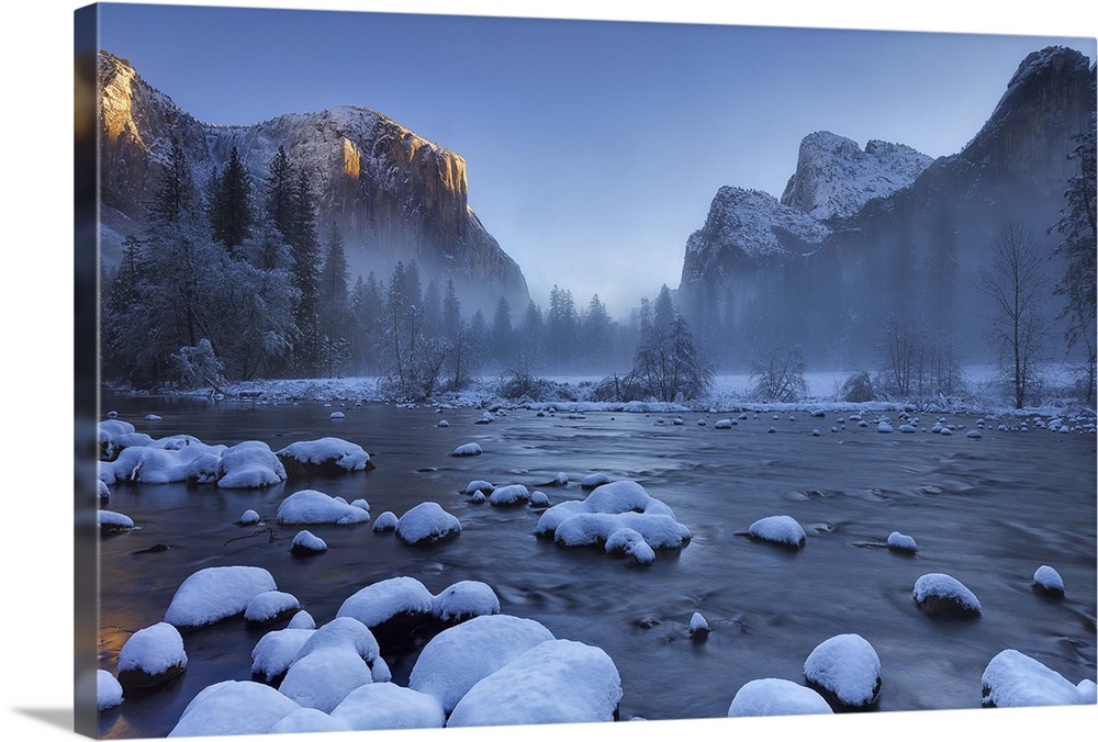 Sunrise in Valley view with the Merced river in the foreground after a fresh snow storm deposited a few inches of snow in ...