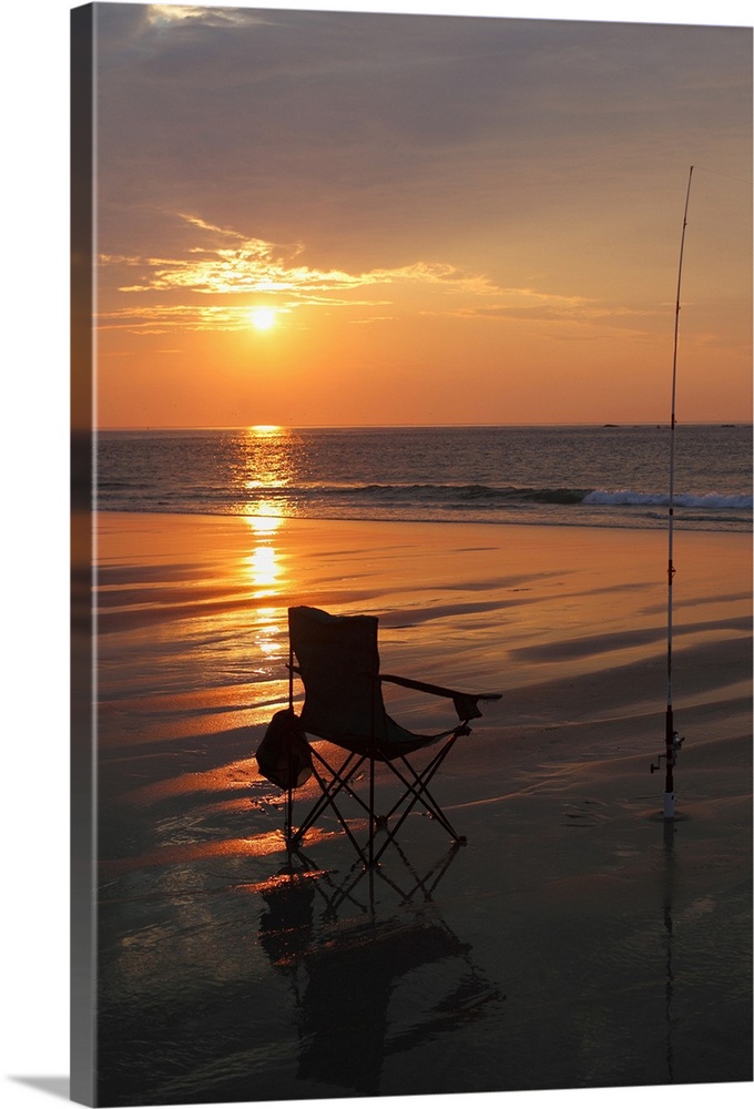 Fishing rod and chair by the ocean in the early morning.