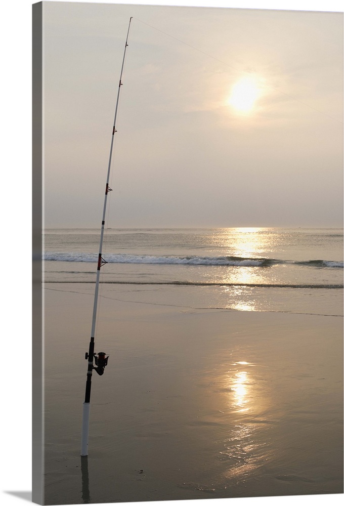 Fishing rod by the ocean in the early morning.