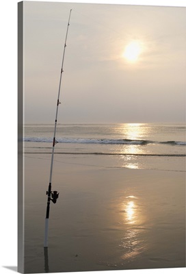 Fishing rod by the ocean in the early morning