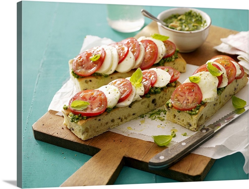 Focaccia topped with pesto, tomatoes and mozzarella Great Big Canvas