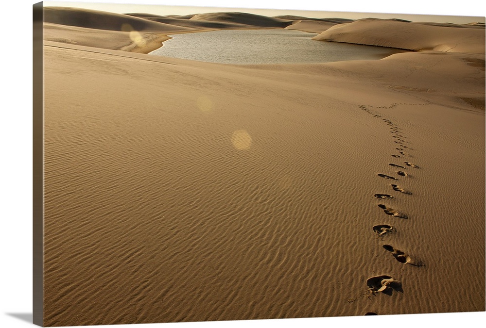 Footprint on sand dune at Lenois Maranhenses in Barreirinhas, Brazil.