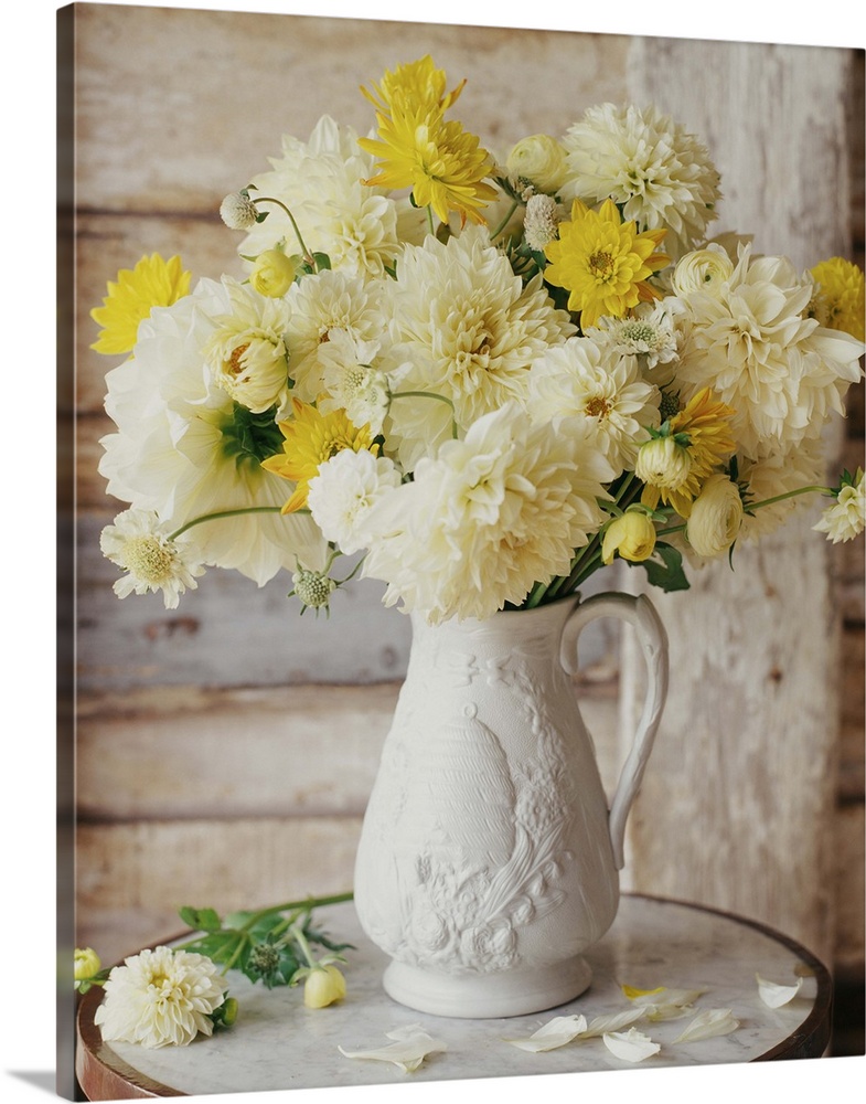 Freshly-cut flowers in a white vase.