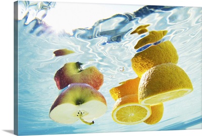 Fruit floating in swimming pool