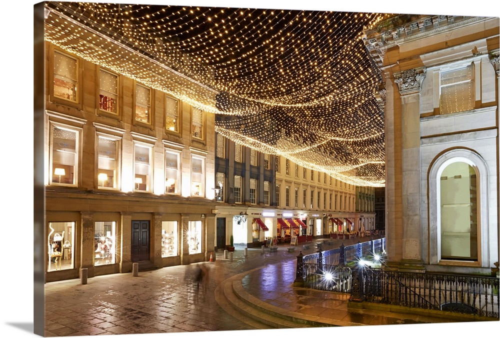 View of the Gallery of Modern Art (GOMA) with Christmas lights illuminating Royal Exchange Square shopping area.
